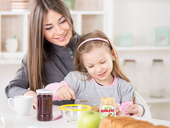 Mother and daughter at breakfast